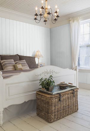 Bedroom painted with a light grey paint colour